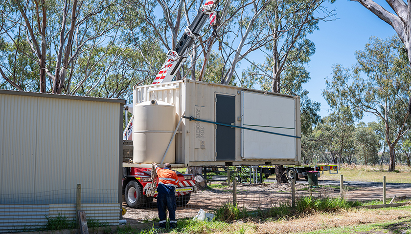 Crane lowering recovery pod at Walker Flat