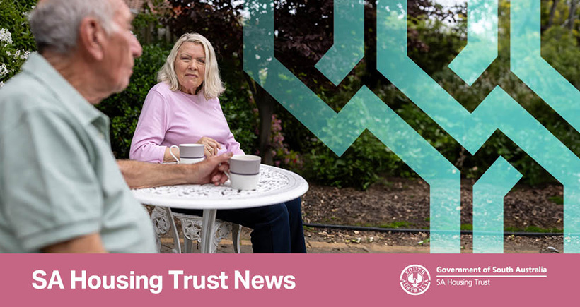 Couple sitting outside in the garden enjoying a cup of coffee