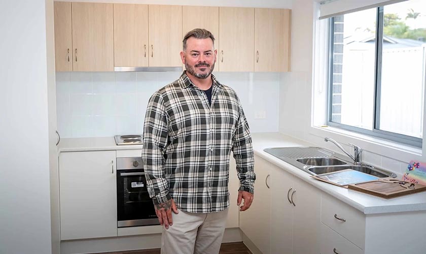Sean standing in the kitchen of his new Salisbury East home