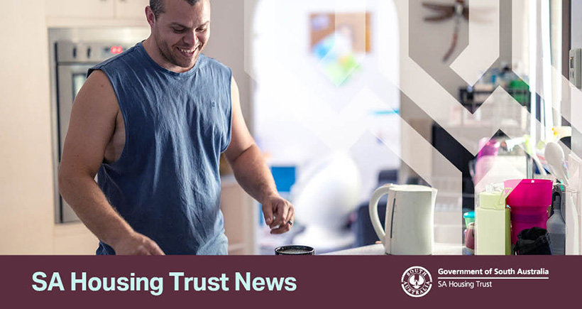Young man in the kitchen making a cup of coffee