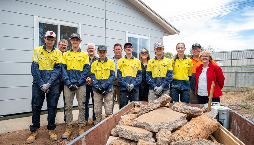 Julie-Anne Burgess and Fiona Curnow from the SA Housing Trust with the students from Samaritan College