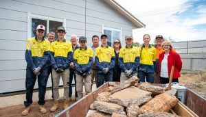 Julie-Anne Burgess and Fiona Curnow from the SA Housing Trust with the students from Samaritan College