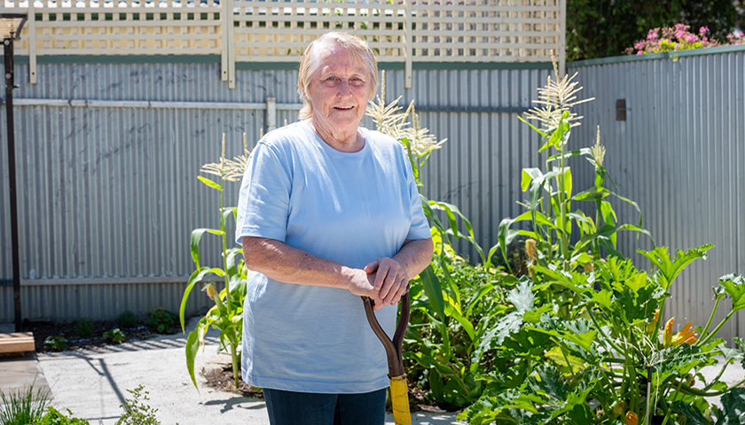 SA Housing Trust tenant Janice gardening in her backyard.